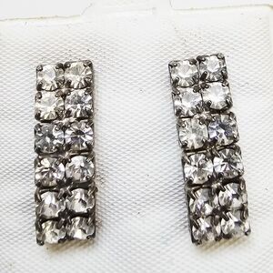 Art Deco style rhinestone earrings with a rectangular design and silver-tone set